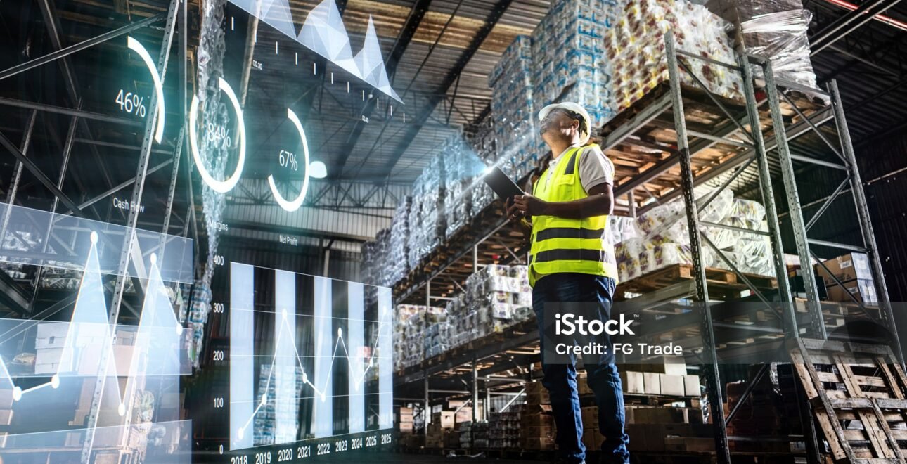 Employee analyzing virtual data with augmented reality interface in a warehouse