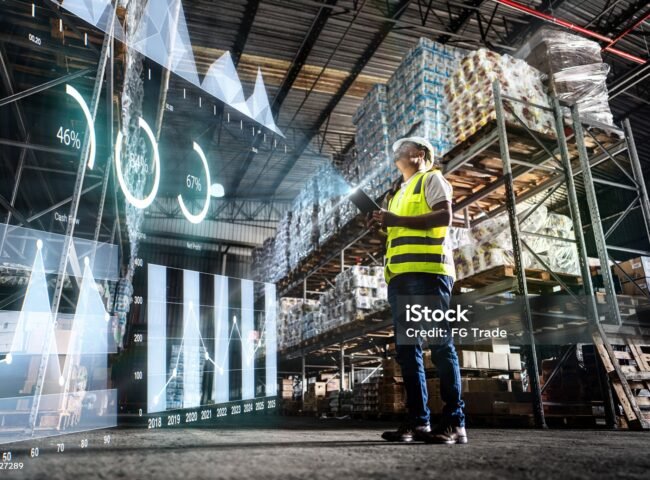 Employee analyzing virtual data with augmented reality interface in a warehouse