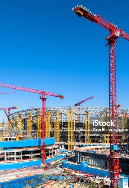 Construction site with tower cranes and unfinished buildings